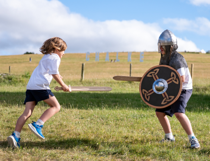 School children learning to sword fight at the Chalke History Festival